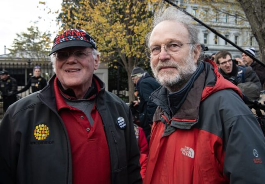 Ben Cohen (L) and Jerry Greenfield, the founders of Ben and Jerry's ice cream, stand outsi