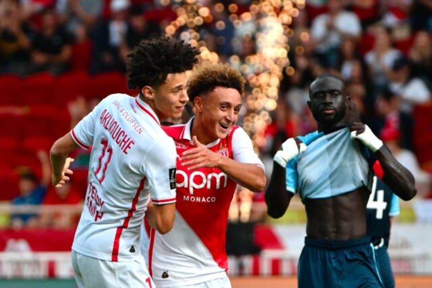 Maghnes Akliouche (L) and Eliesse Ben Seghir (C) celebrate together during a Ligue 1 game