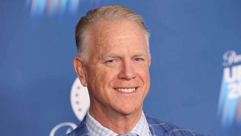 Boomer Esiason smiles