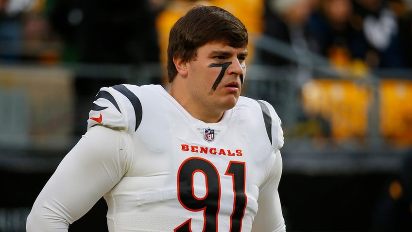 Trey Hendrickson jogs onto the field