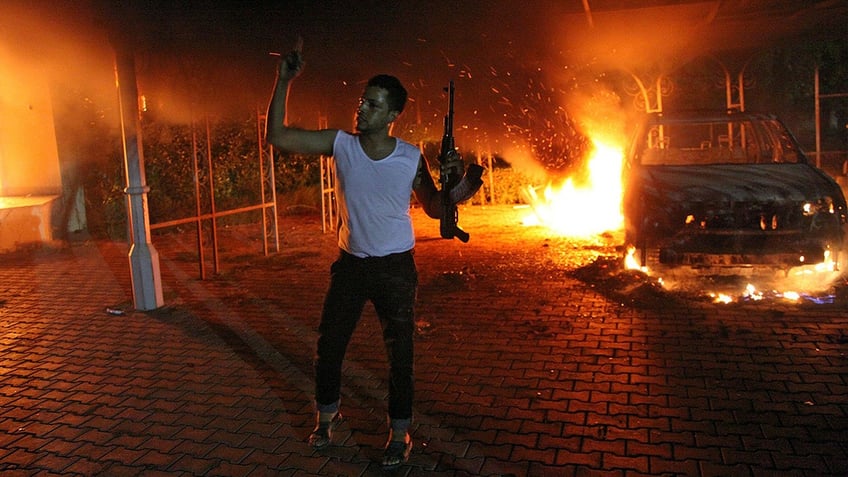 Man in Benghazi waving a rifle