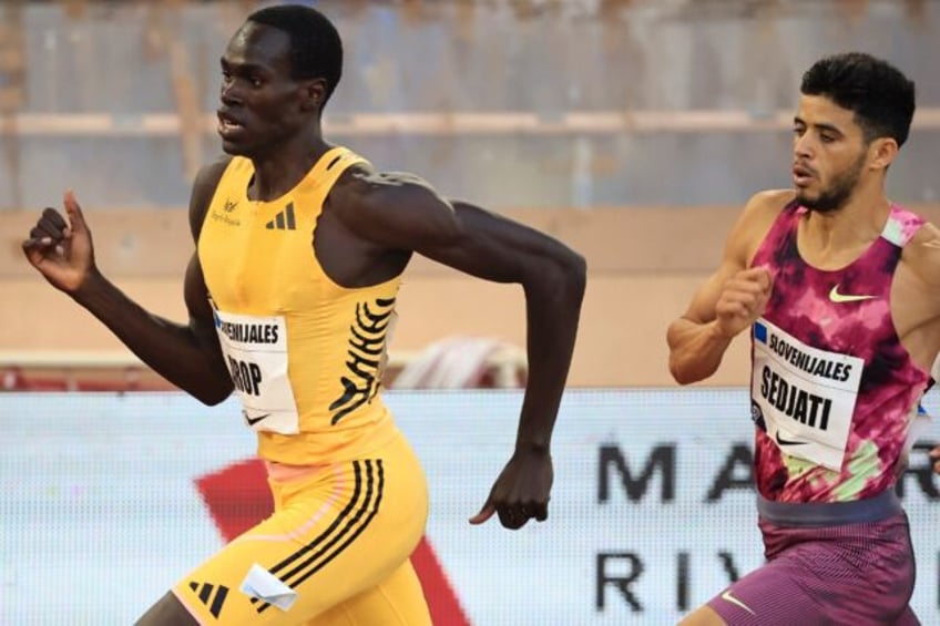 Algeria's Djamel Sedjati (R) and Canada's Marco Arop (L) compete in the men's 800m