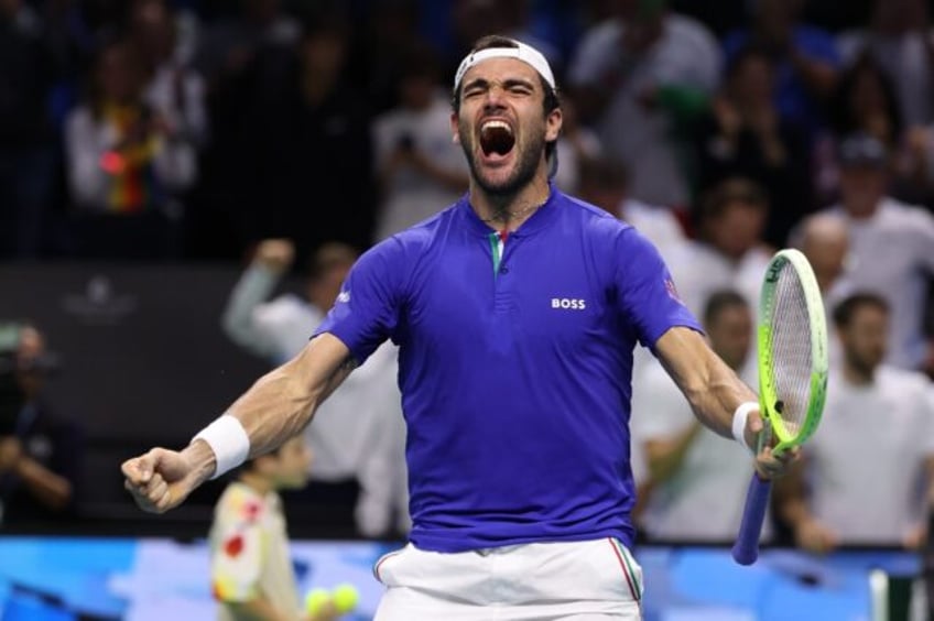 Matteo Berrettini of Team Italy celebrates beating Thanasi Kokkinakis of Team Australia in