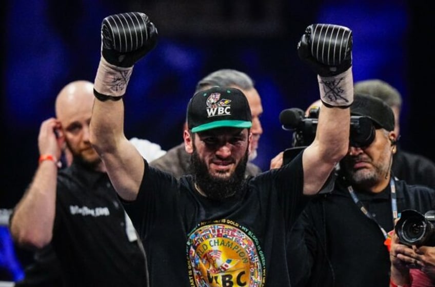 Canada's Artur Beterbiev celebrates his victory against Britain's Callum Smith in their WBC, IBF and WBO light-heavyweight world championship fight in Quebec City, Canada