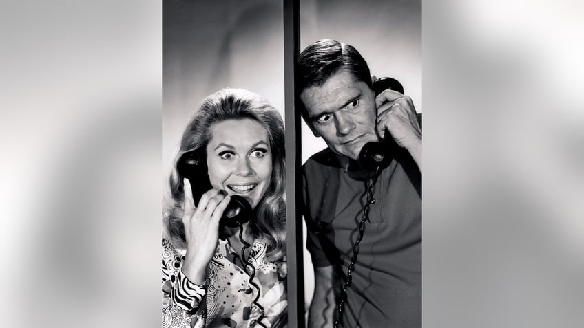 Dick York and Elizabeth Montgomery talking on the phone.