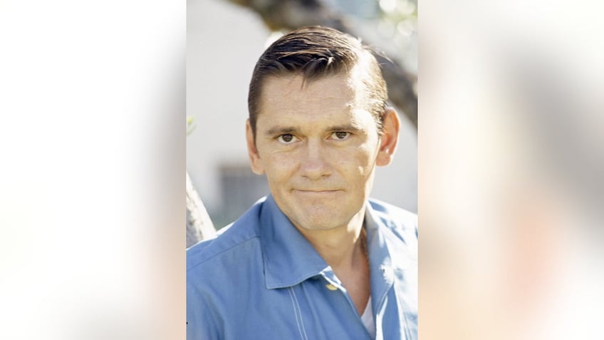 A close-up of Dick York in a blue shirt.