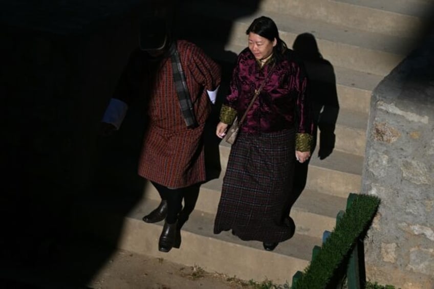 Voters arrive at a polling station in Thimphu