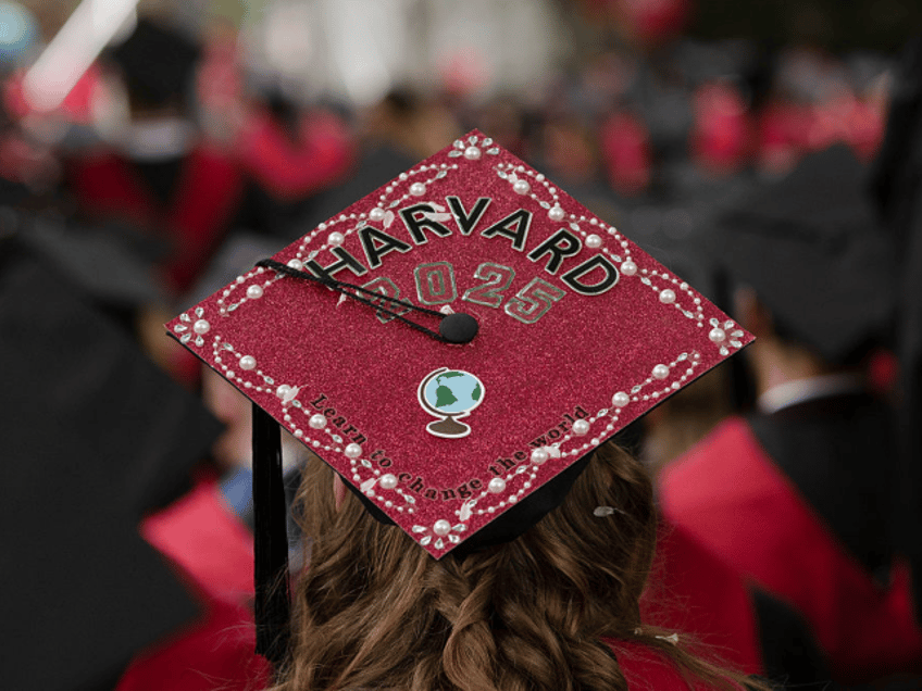CAMBRIDGE, MASSACHUSETTS - MAY 29: A graduate's cap reads "Learn to Change the World" duri