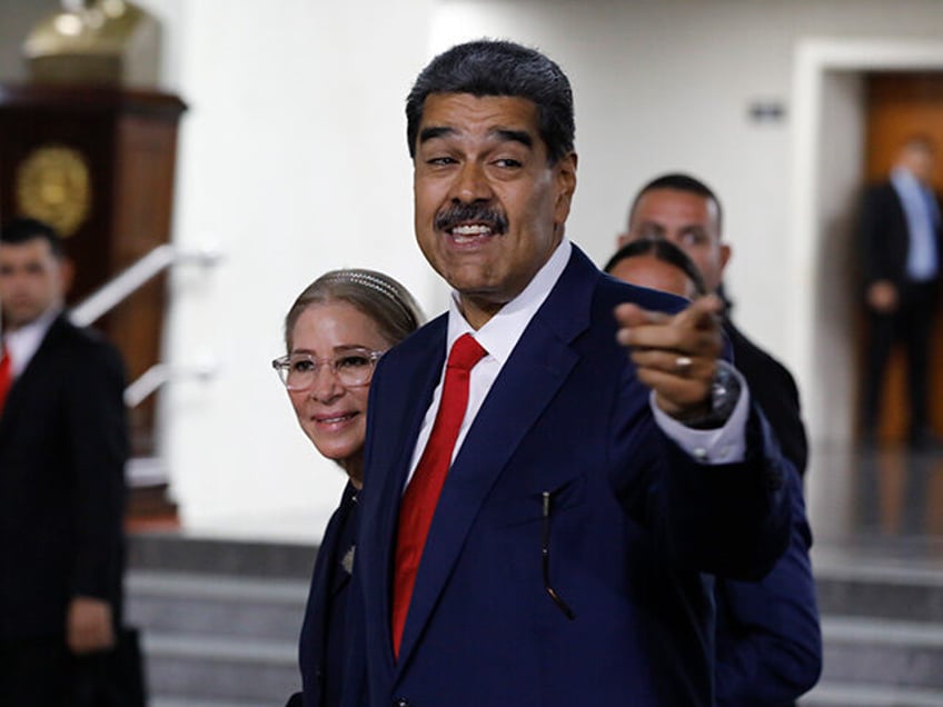 Venezuelan President Nicolas Maduro and his wife Cilia Flores leave the Supreme Court afte