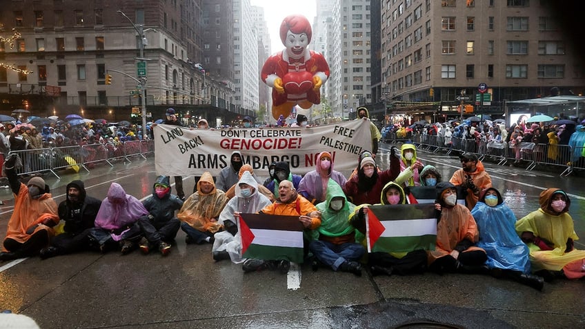 Protesters blocking parade route