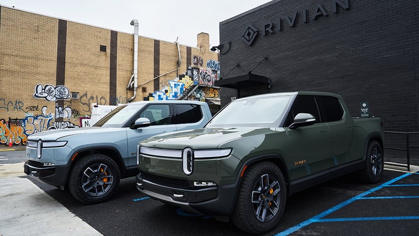 Rivian R1T electric pickup trucks parked at a Rivian service center in the Brooklyn borough of New York on Monday, Oct. 30, 2023. 