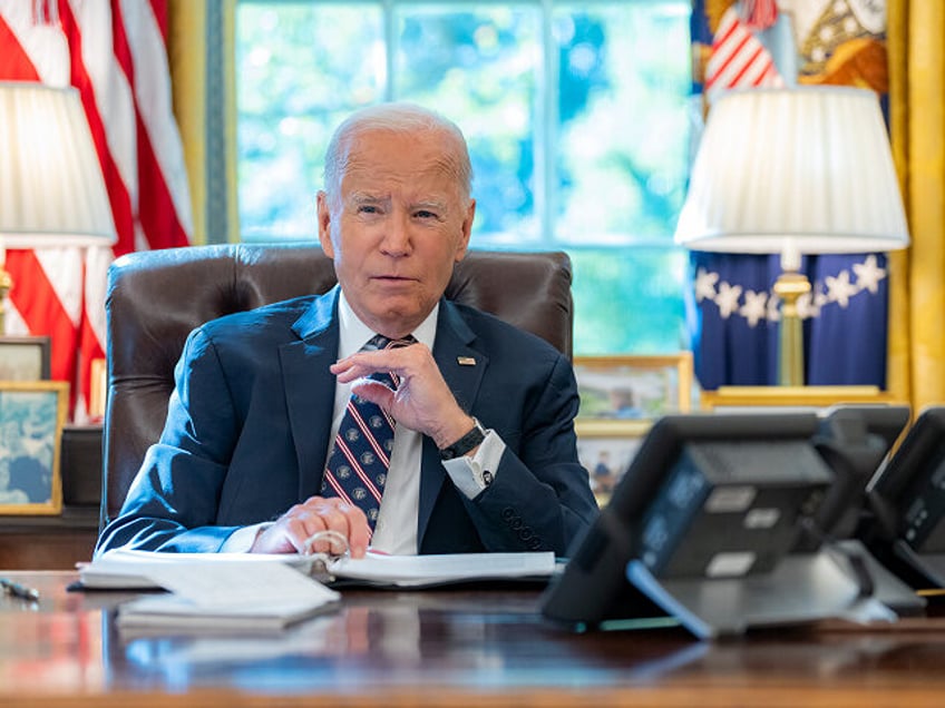 President Joe Biden talks on the phone with President Isaac Herzog of Israel in the Oval O