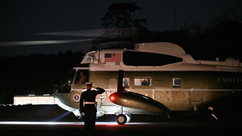 biden apparently bumps his head on marine one as debate persists over presidents mental fitness