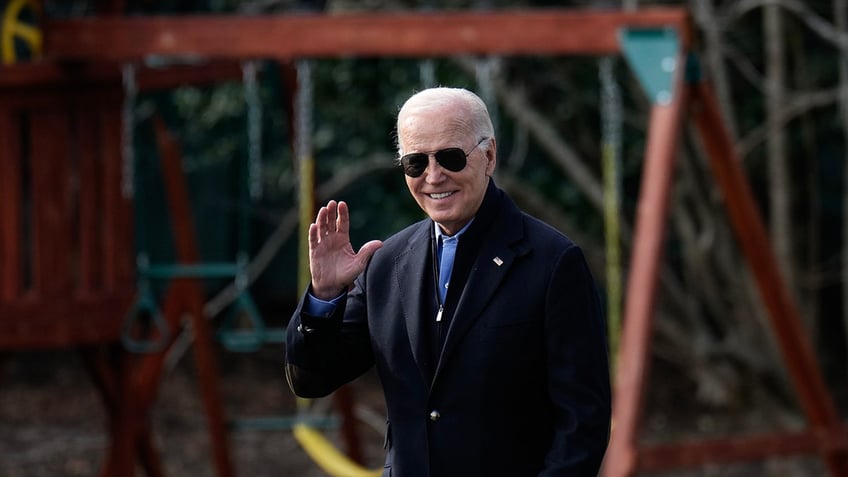 Biden waves to reporters