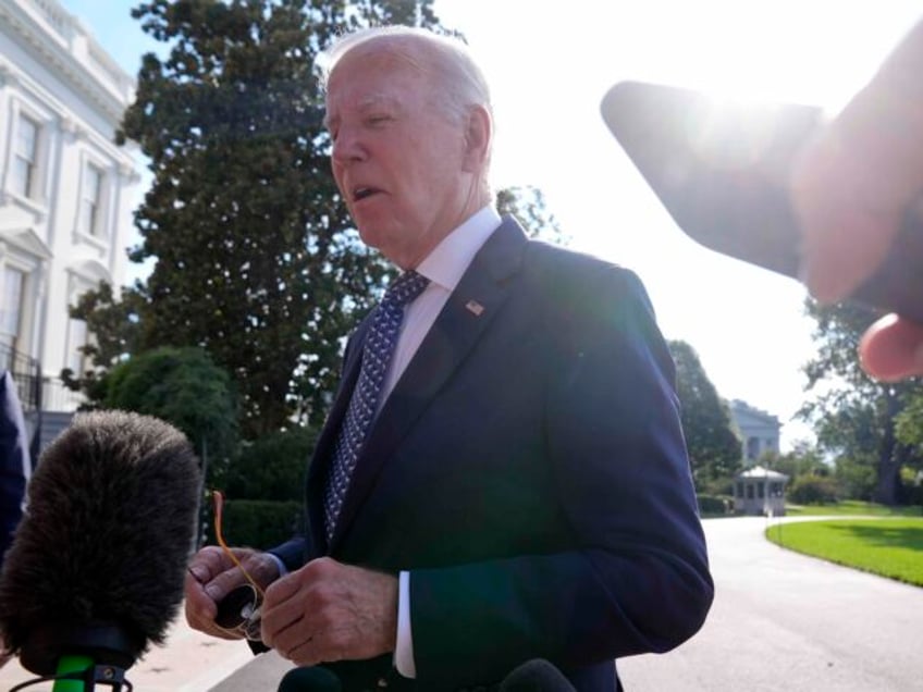 President Joe Biden talks to reporters on the South Lawn of the White House, Monday, Sept.