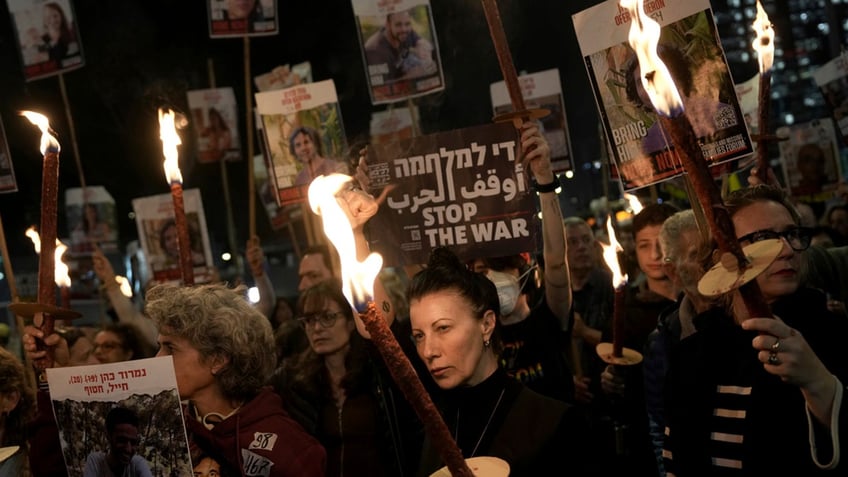 Relatives and friends of people killed and abducted by Hamas and taken into Gaza, react to the ceasefire announcement as they take part in a demonstration in Tel Aviv, Israel, on Wednesday.