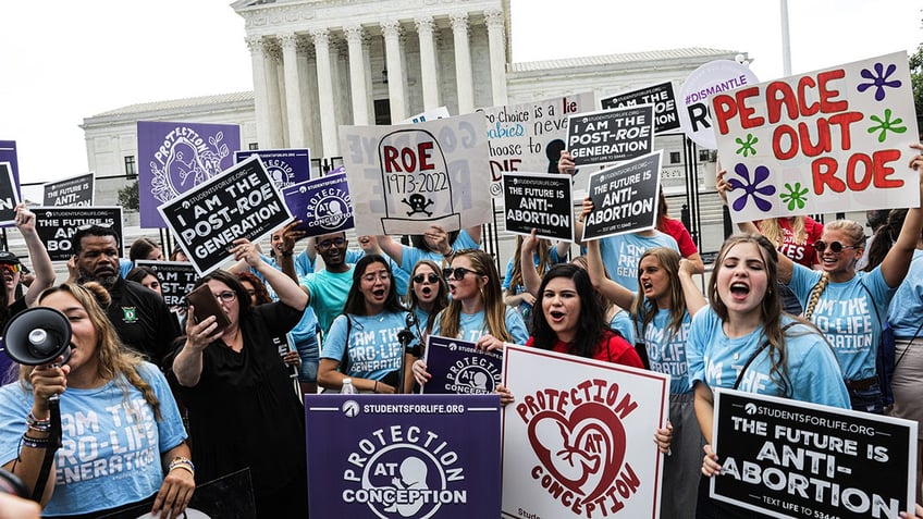 Demonstrators protest Supreme Court