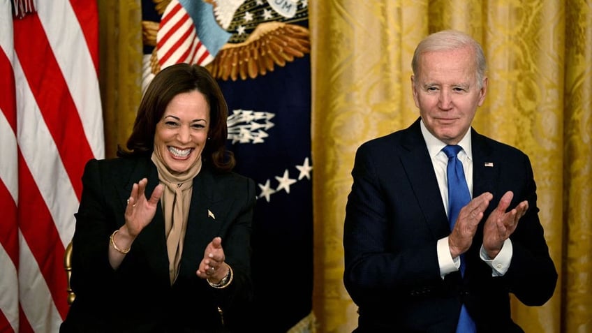 Kamala and Joe Biden clap during a White House conference