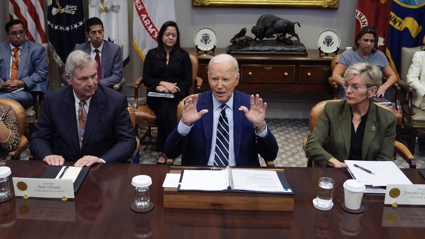 President Biden, center, delivers remarks on the federal government's response to Hurricane Helene and preparations for Hurricane Milton in the Roosevelt Room of the White House on Tuesday, Oct. 8, 2024 in Washington, D.C.