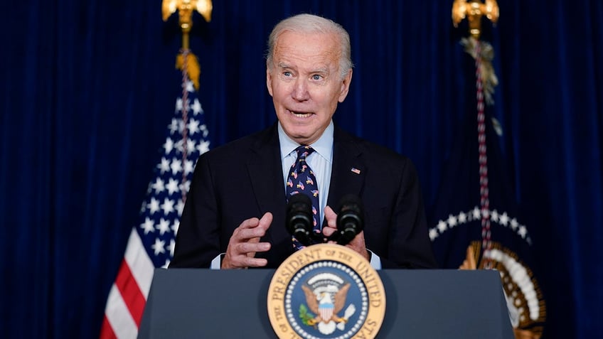 Biden speaking at a podium