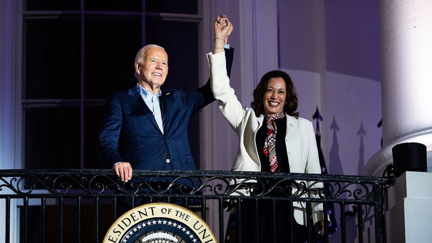 Joe Biden, Kamala Harris arms raised on Truman Balcony