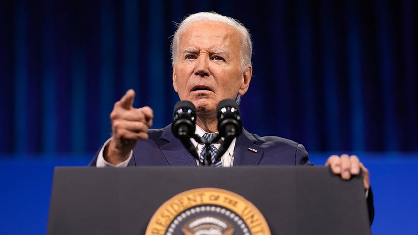 Joe Biden pointing finger at podium