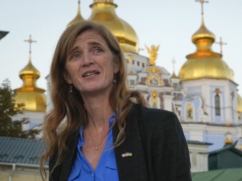 USAID Administrator Samantha Power stands in front of St. Michael's Golden-Domed Mona