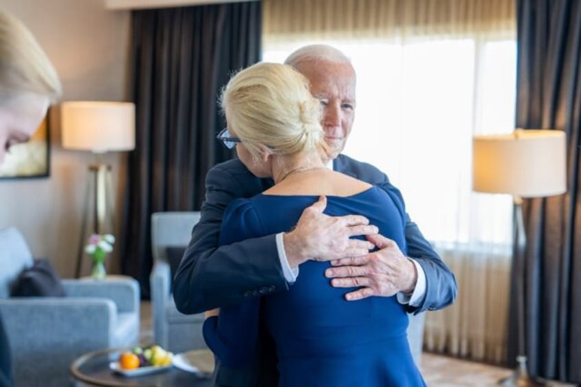 US President Joe Biden hugs Yulia Navalnaya, widow of Kremlin opposition leader Alexei Nav