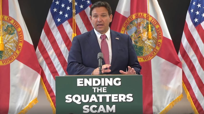 Ron DeSantis at lectern during anti-squatting event