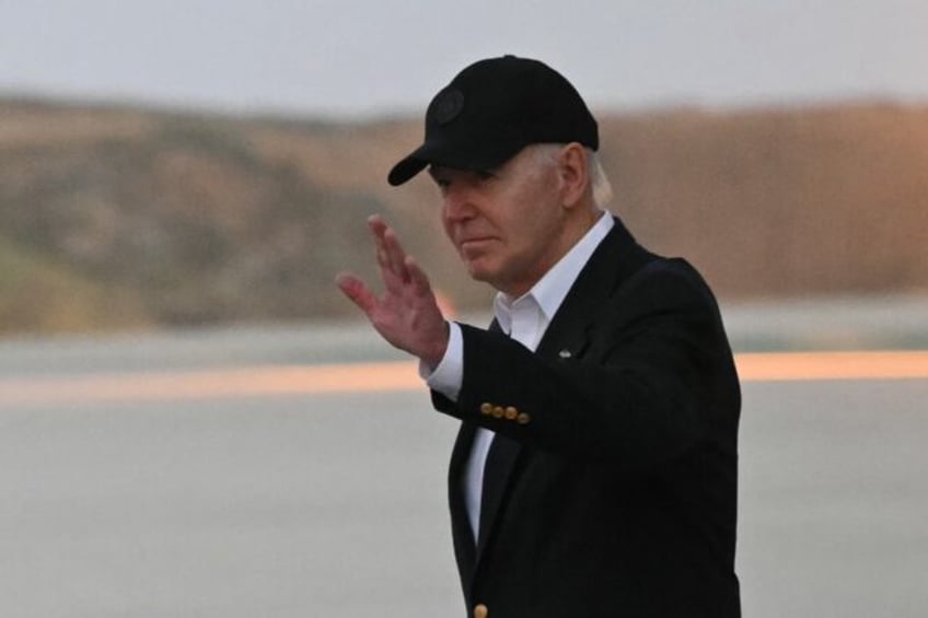 US President Joe Biden steps off Air Force One upon arrival at Los Angeles International A