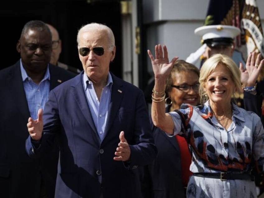 US President Joe Biden, left, and First Lady Jill Biden arrive during a Fourth of July eve