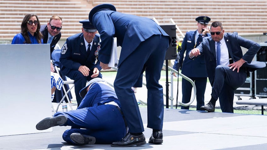 biden nearly stumbles exiting air force one hours after exposed efforts by team to prevent more falls