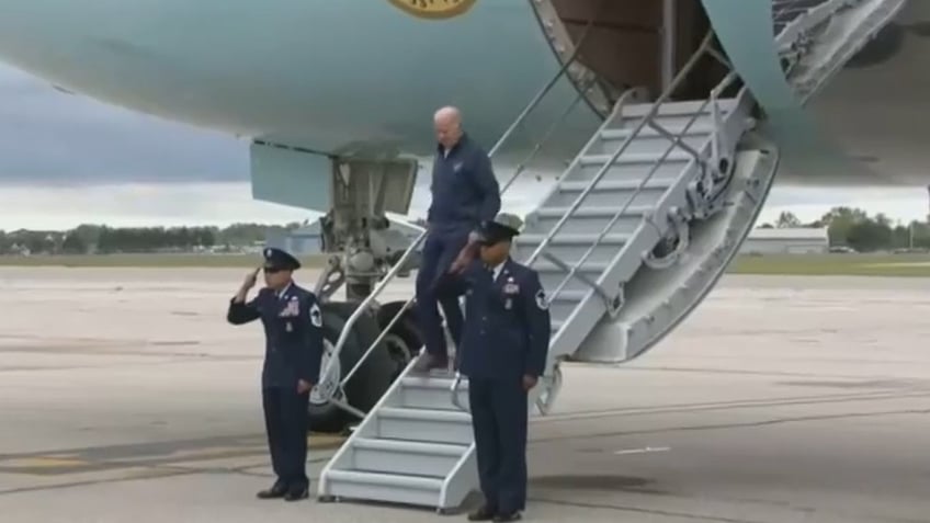 biden nearly stumbles exiting air force one hours after exposed efforts by team to prevent more falls