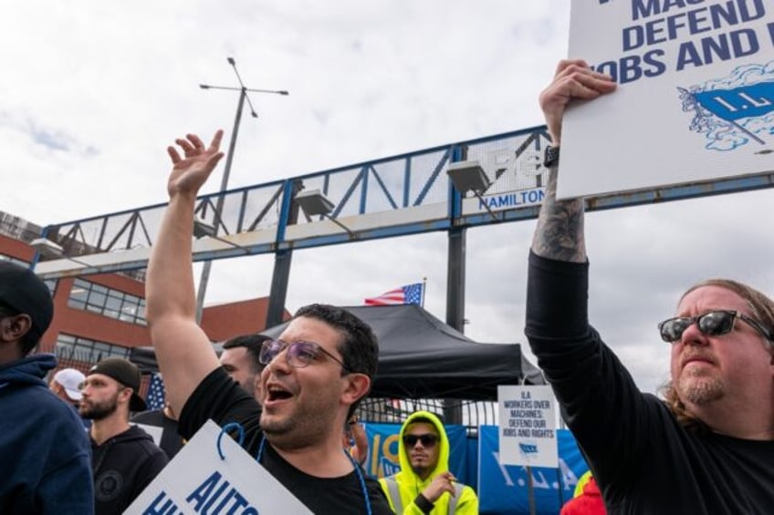 Striking workers at the Red Hook Container Terminal in Brooklyn, New York, gather after me