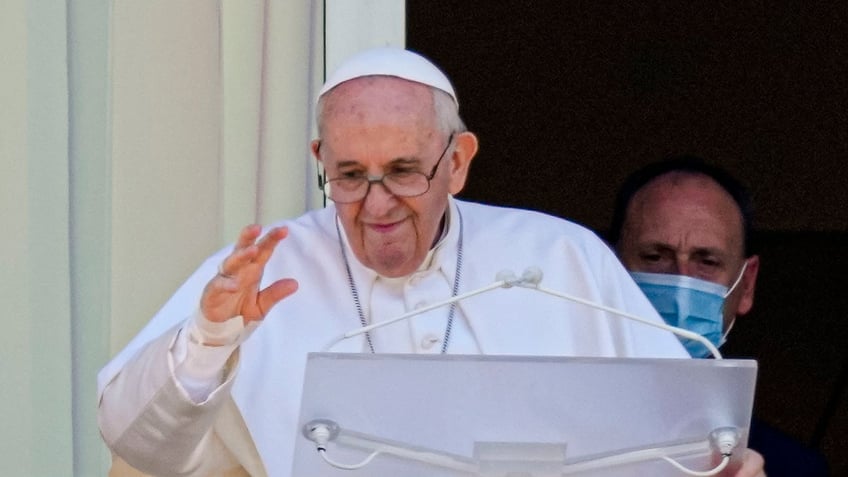 Pope Francis appears on a balcony of the Agostino Gemelli Polyclinic in Rome, Sunday, July 11, 2021. (AP Photo/Alessandra Tarantino)