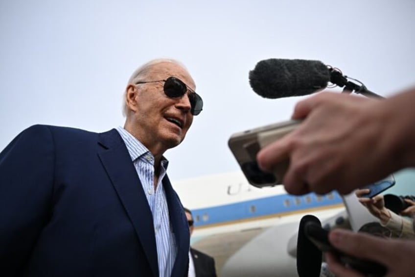 US President Joe Biden speaks to the press before boarding Air Force One at Joint Base And