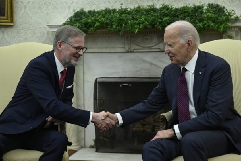 US President Joe Biden (R) meets with Czech Prime Minister Petr Fiala (L) in the Oval Offi