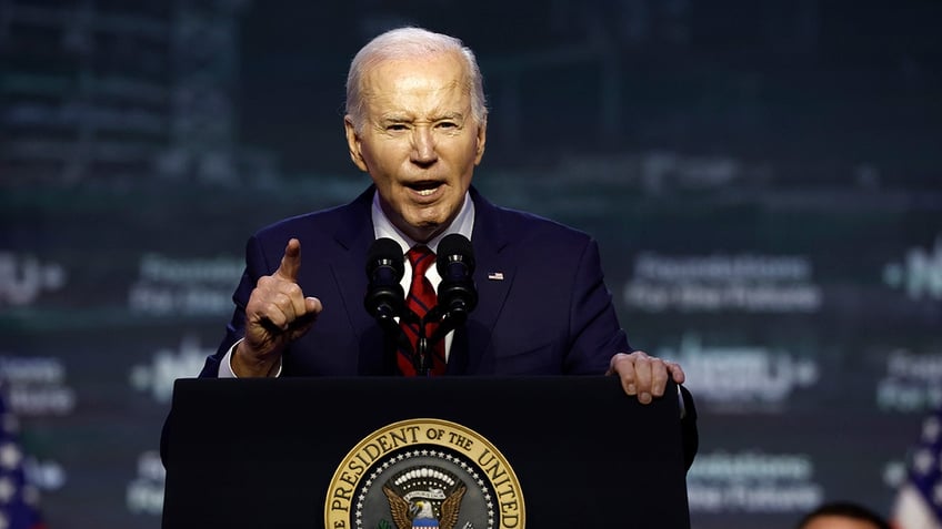 Biden speaking on a podium