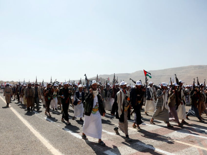 Amran, YEMEN - DECEMBER 20: Yemen's Houthi loyalists take part in an armed parade for more than 20,000 members who have finished a military course, staged to show their willingness to battle any potential attack by the recently created coalition by the U.S., on December 20, 2023 in Amran province, …