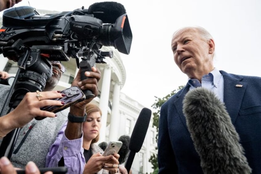 US President Joe Biden speaks to the media prior to departing on Marine One from the South