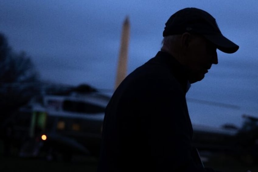 US President Joe Biden speaks to the press before departing the White House for the Camp D