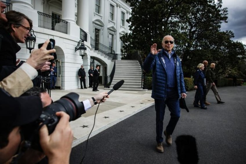 US President Joe Biden stops to speak to the press before boarding Marine One as he depart