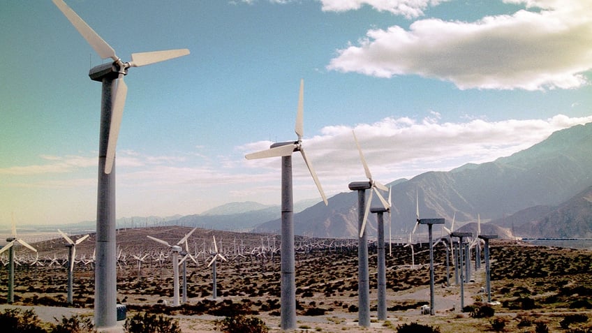 Wind turbines produce energy from wind at Whitewater Energy's Wind Turbine Farm in the desert.