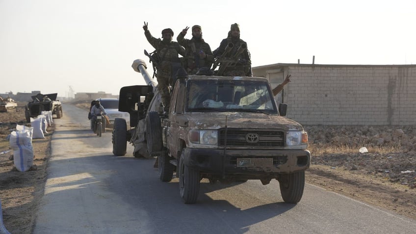 Rebels in northwest Syria seized military vehicles belonging to the regime along the route toward Kweris Airport on Dec. 2, 2024.