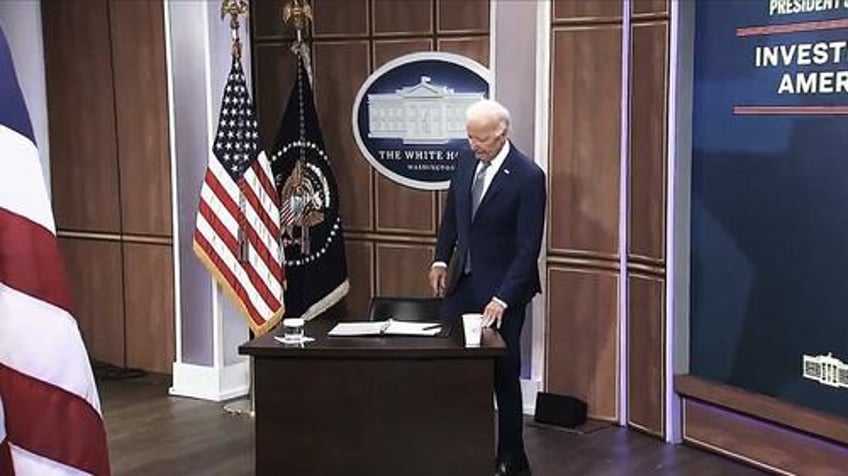 biden sits at tiny fake white house desk