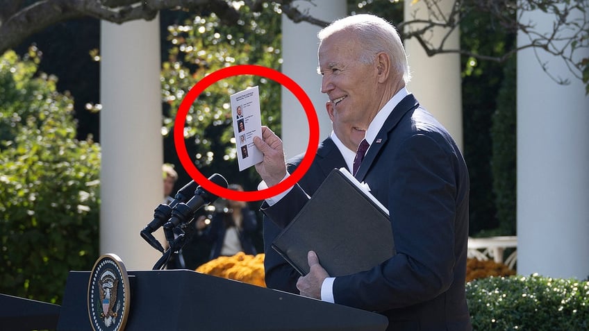 biden spotted holding a note card with reporters photos and names to call on at joint presser