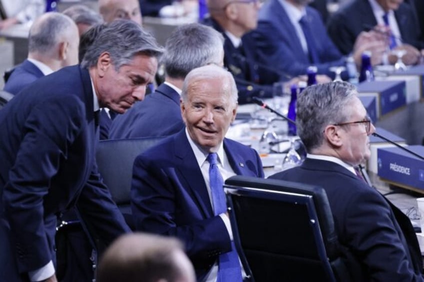 US President Joe Biden speaks with US Secretary of State Antony Blinken during the NATO su