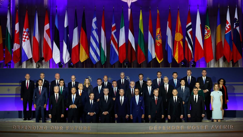 Heads of state pose for a group photo