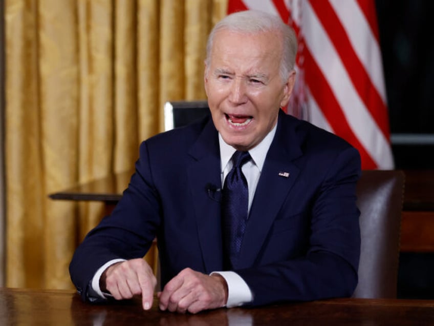 biden ties israel to ukraine in oval office address from white house bathed in red light