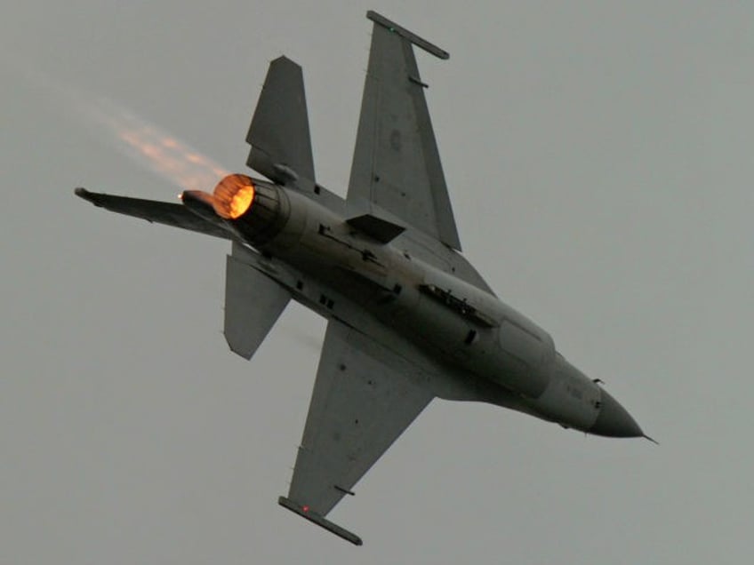 A US-made F-16 fighters jets through the air during an scramble take off at the eastern Hualien air force base on January 23, 2013. The Taiwan air force demonstrated their combat skills at the Hualien air base during an annual training before the coming lunar new year. AFP PHOTO / …